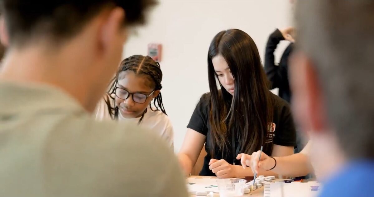 Two students collaborating on a hands-on activity at the SLRP training.