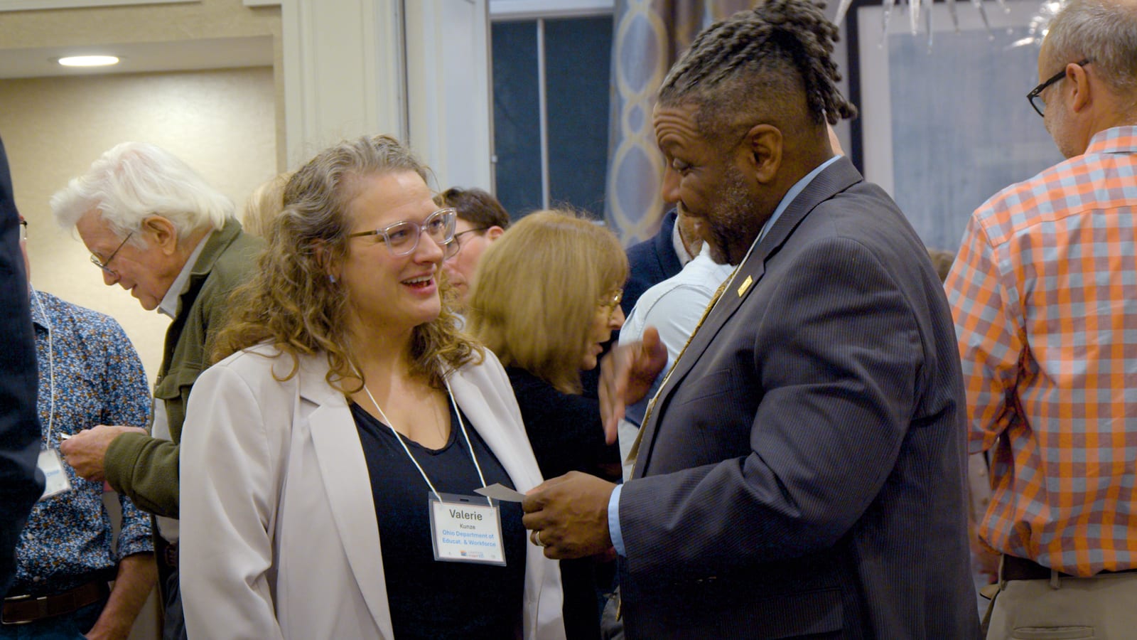 Educators greeting one another and exchanging introductions at the summit.